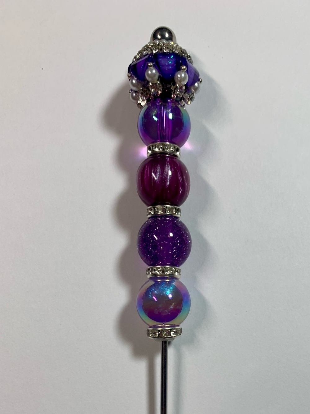 Purple beaded pokey tool.